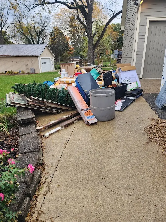 Dumpster being loaded with debris for 3 Yard Dumpster Rental in North Brooksville